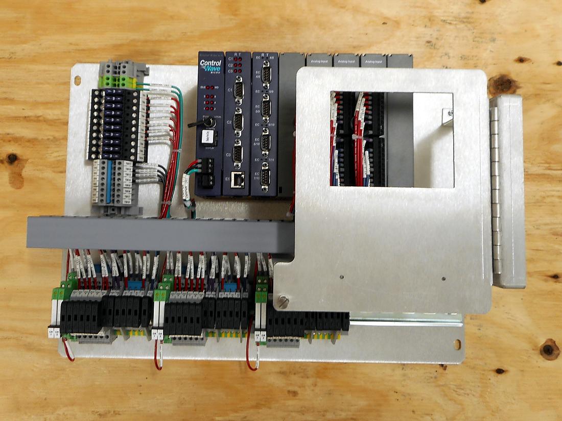 Retrofit backplate with controller and marshalling terminals ready to drop into an existing enclosure