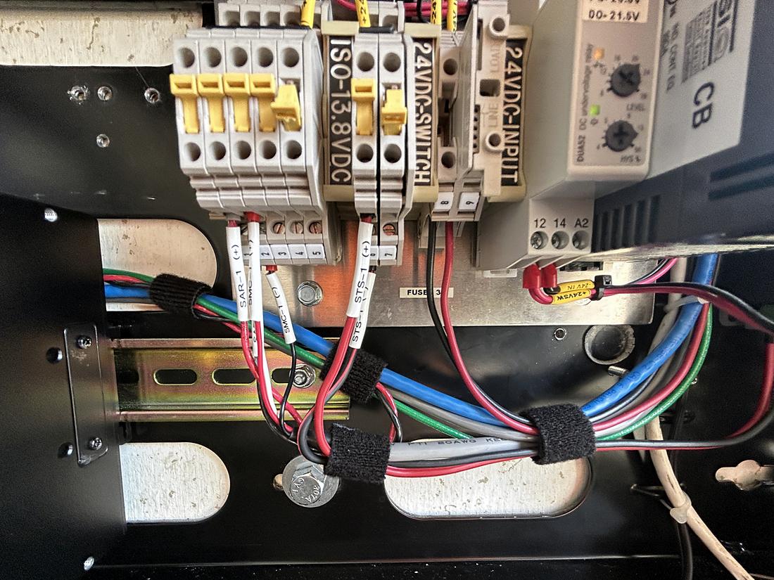 24 volt DC distribution wiring on DIN rail inside a site cabinet