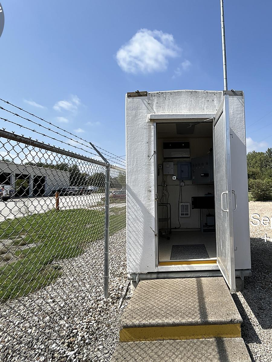 Communications shelter with door open after commissioning