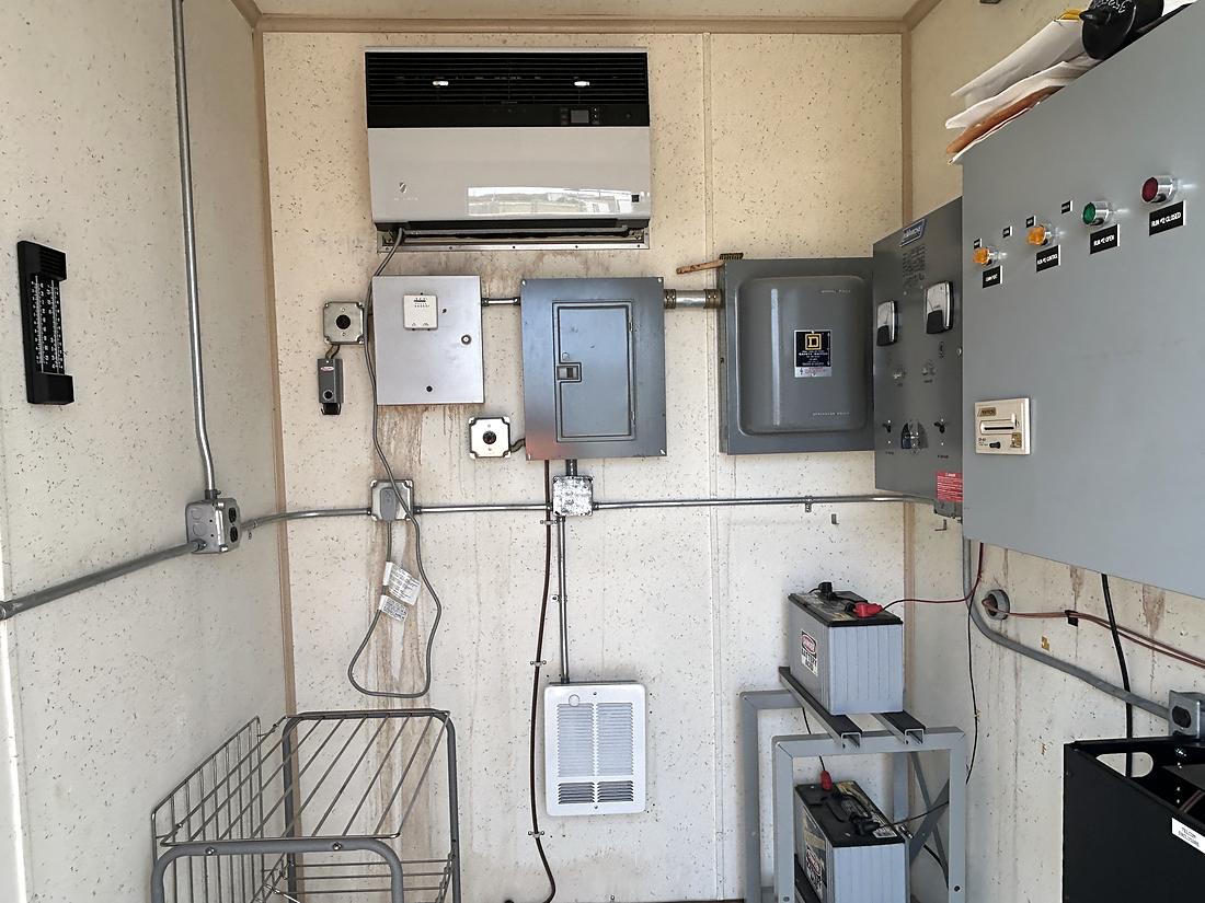 Shelter interior with power distribution, HVAC and battery bank